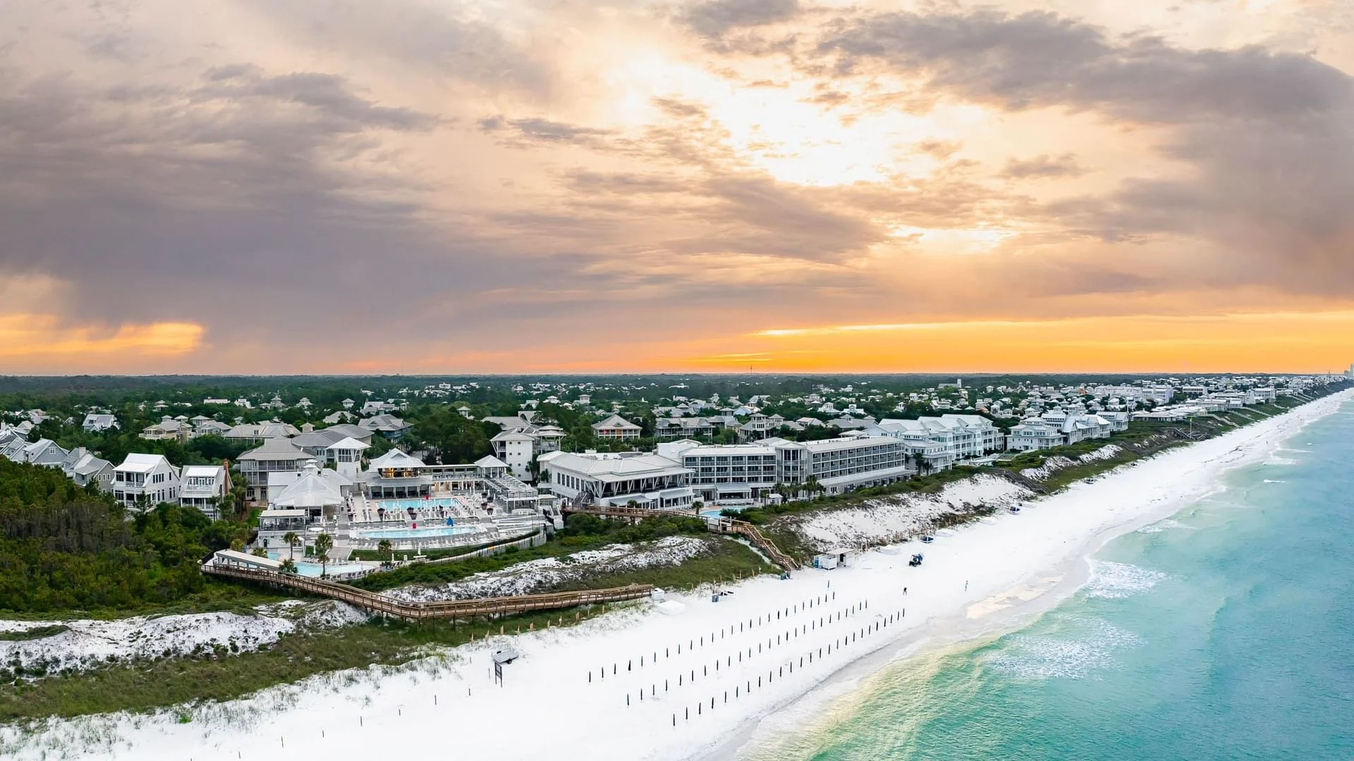 Sunset aerial of WaterColor Inn, white Gulf beaches and the WaterColor coastal neighborhood